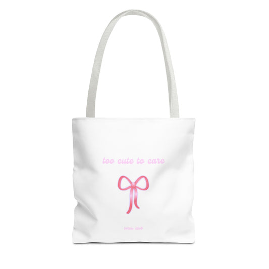White tote bag with pink bow and text on a white background